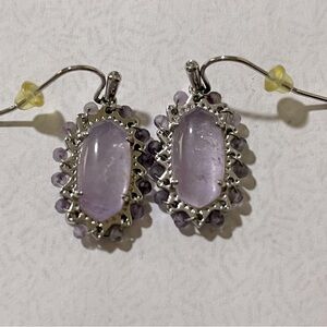 Kendra Scott silver French wire earrings.
